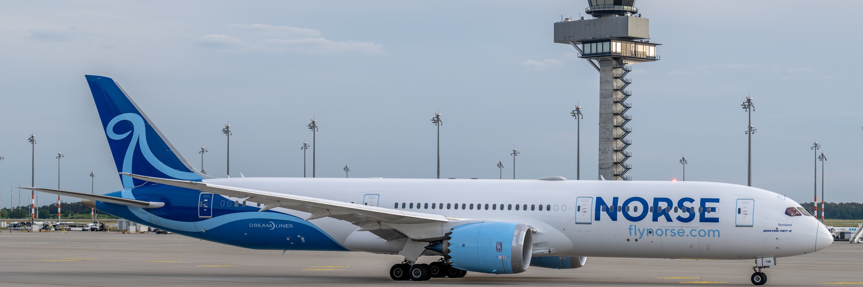 Norse aircraft on the apron. Behind it the BER tower