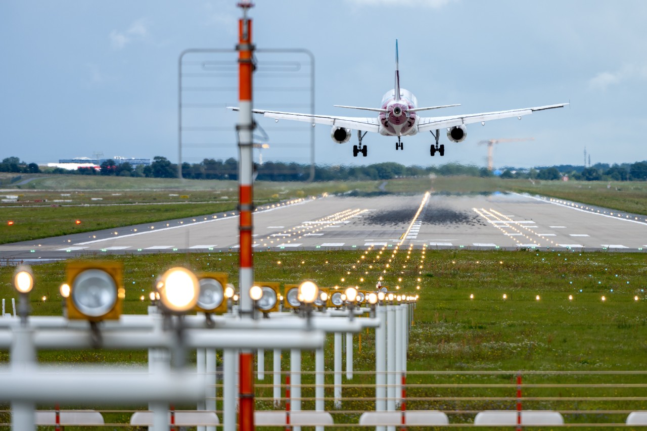 Aircraft shortly before touching down on the runway.