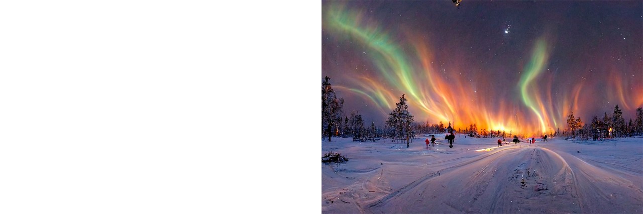 Blick auf Polarlichter über verschneiter Winterlandschaft mit Menschen im Schnee.