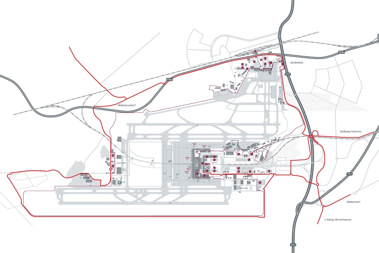 Karte von Berlin und Umgebung mit Darstellung wichtiger Autobahnen und Bundesstraßen. Das Berliner Stadtgebiet ist grau markiert, der Flughafen Berlin Brandenburg (BER) ist im Südosten deutlich hervorgehoben durch ein Flugzeugsymbol und die Beschriftung ‚BER‘ in Dunkelrot. Die Karte zeigt die Autobahnen A10, A100, A113 und A115 sowie Anschlussstellen, die die gute Straßenanbindung des Flughafens verdeutlichen. Zusätzlich sind Radwege in Berlin und dem Umland als rote Linien eingezeichnet.
