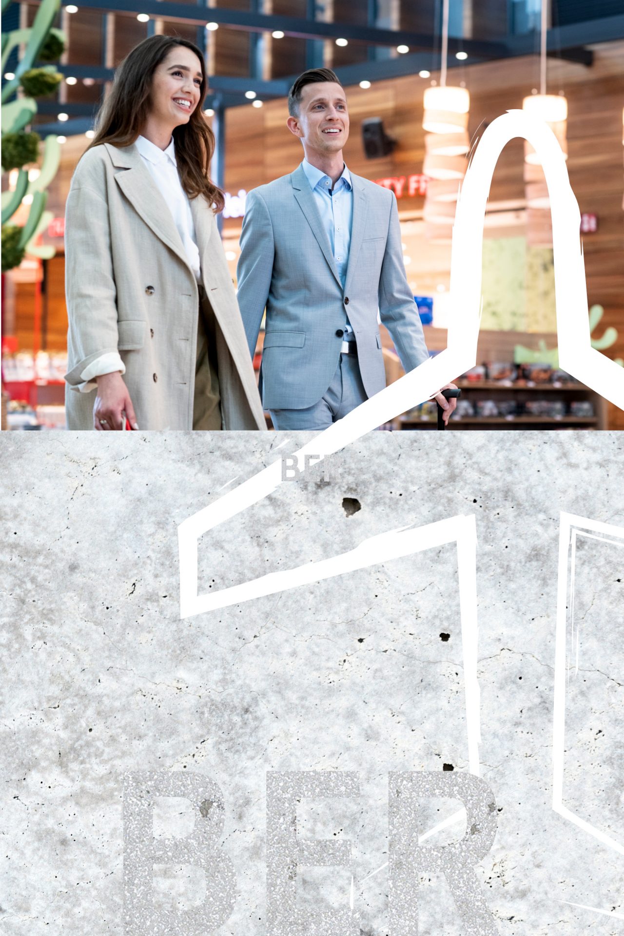 2 people with shopping bags walk through the marketplace
