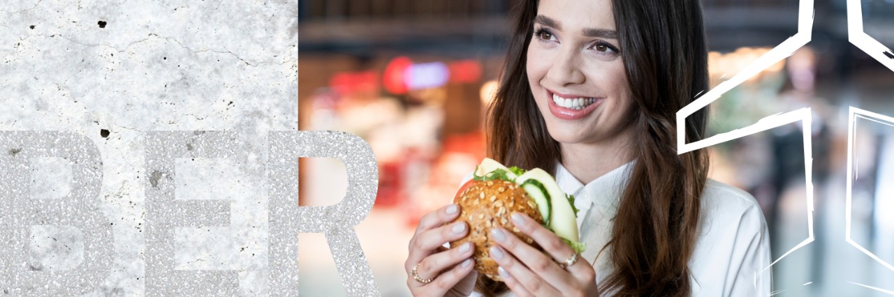 1 person with a sandwich
