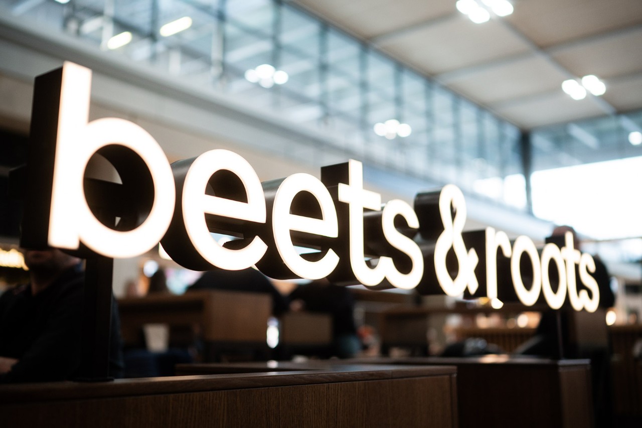 Lettering from beets & roots on a counter.