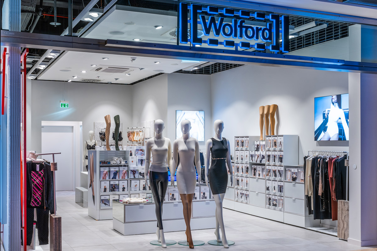 View from outside the Wolford store. 3 window mannequins are wearing different clothes.