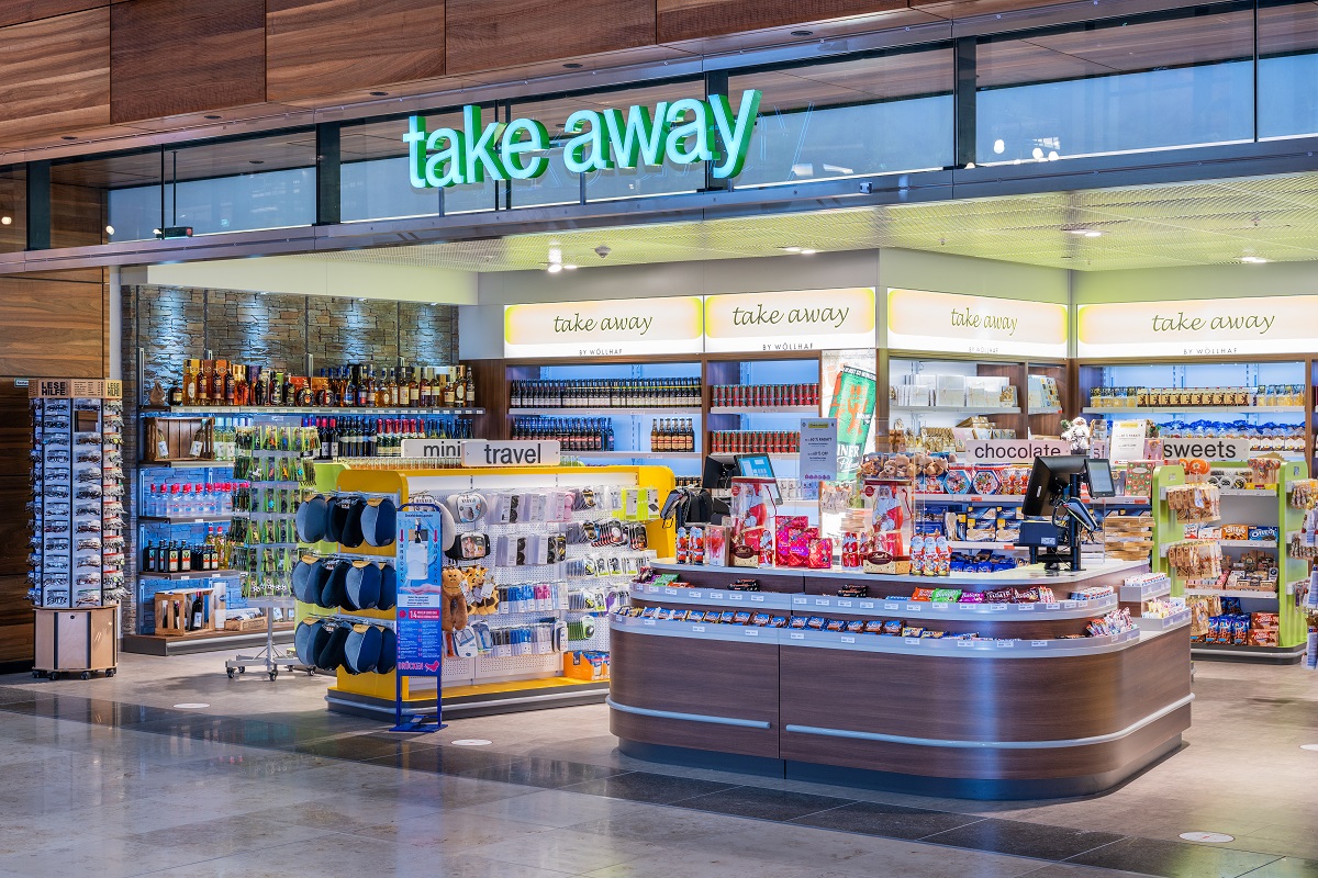 View of the take-away store from outside. Postcards, travel accessories and toys on display.