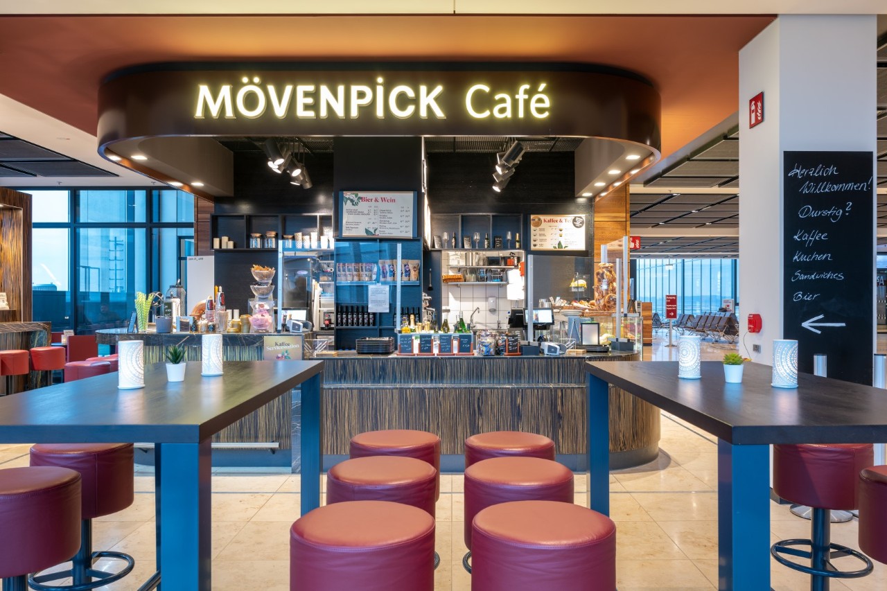 Chairs and tables in the Mövenpick Café. Behind the counter.