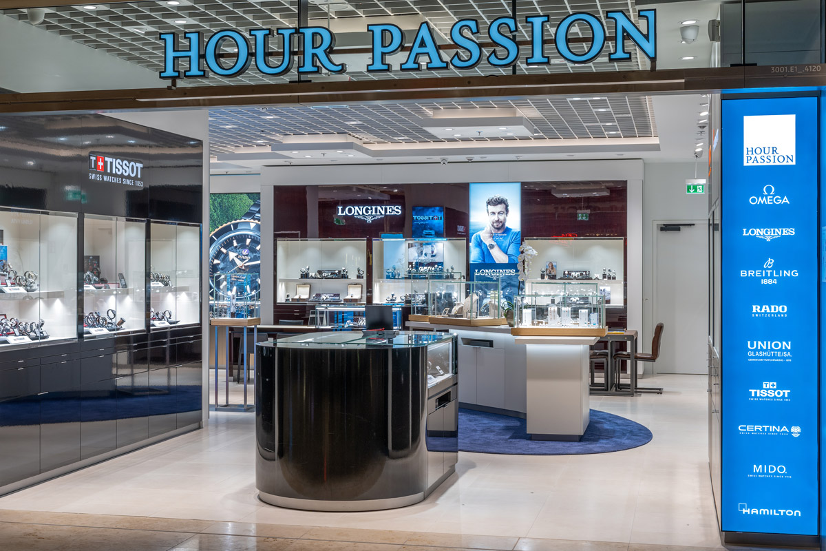 View of the Hour Passion store from outside. Watches on display.
