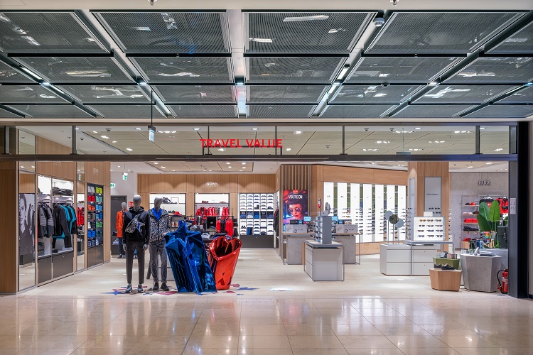 View into the Heinemann store with mannequins and clothing.
