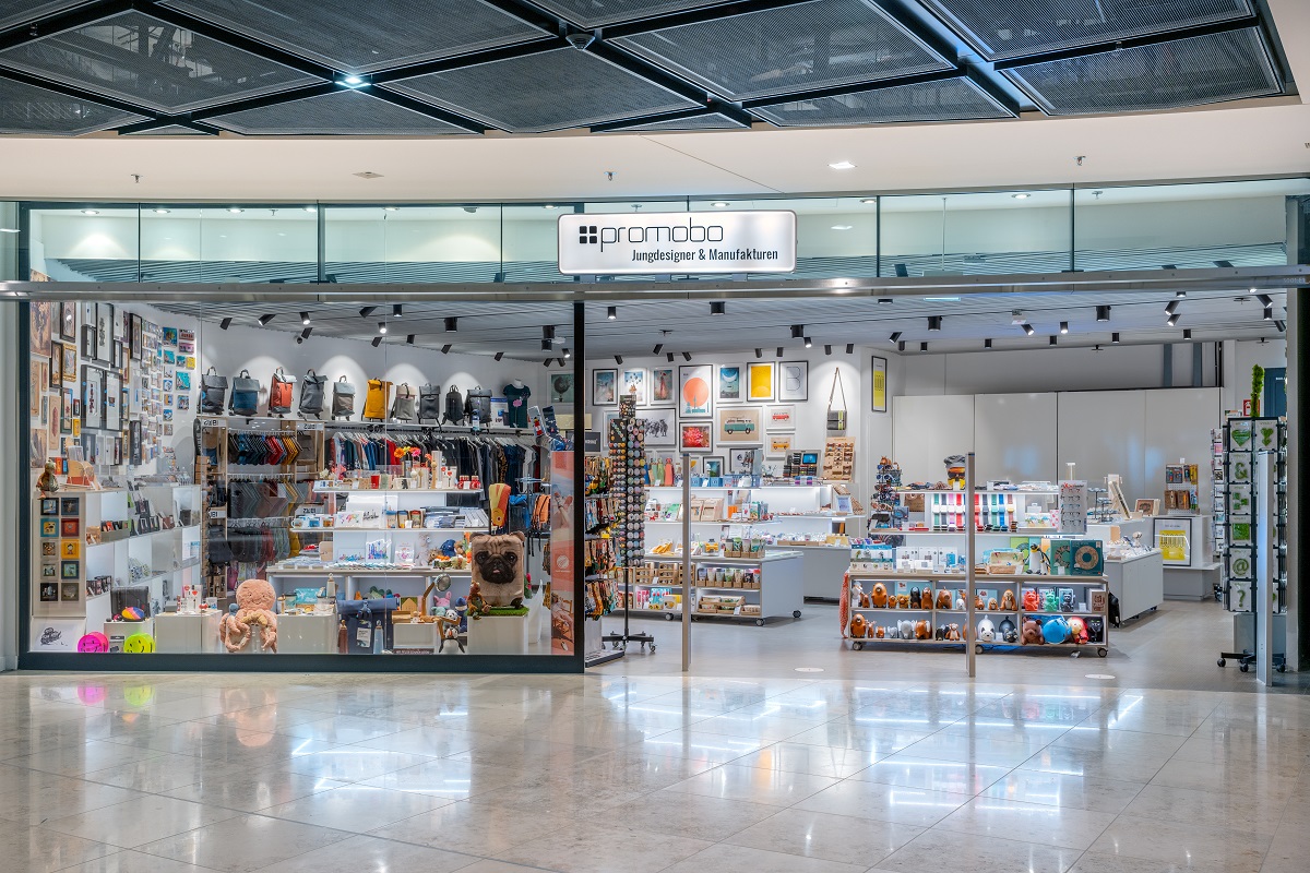 View of the Promobo store from outside. Articles on counters and wall shelves.