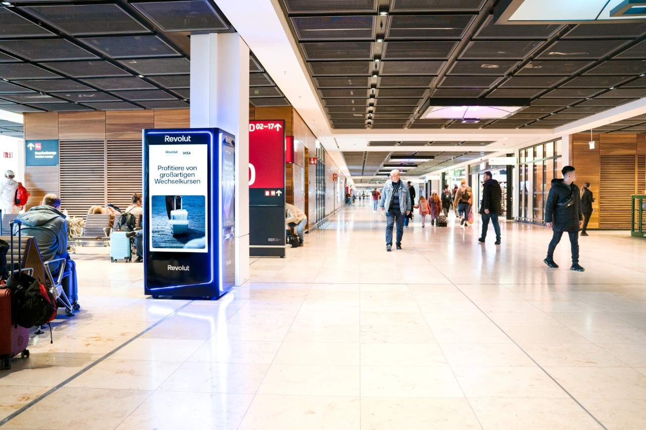A black Revolut ATM in the terminal