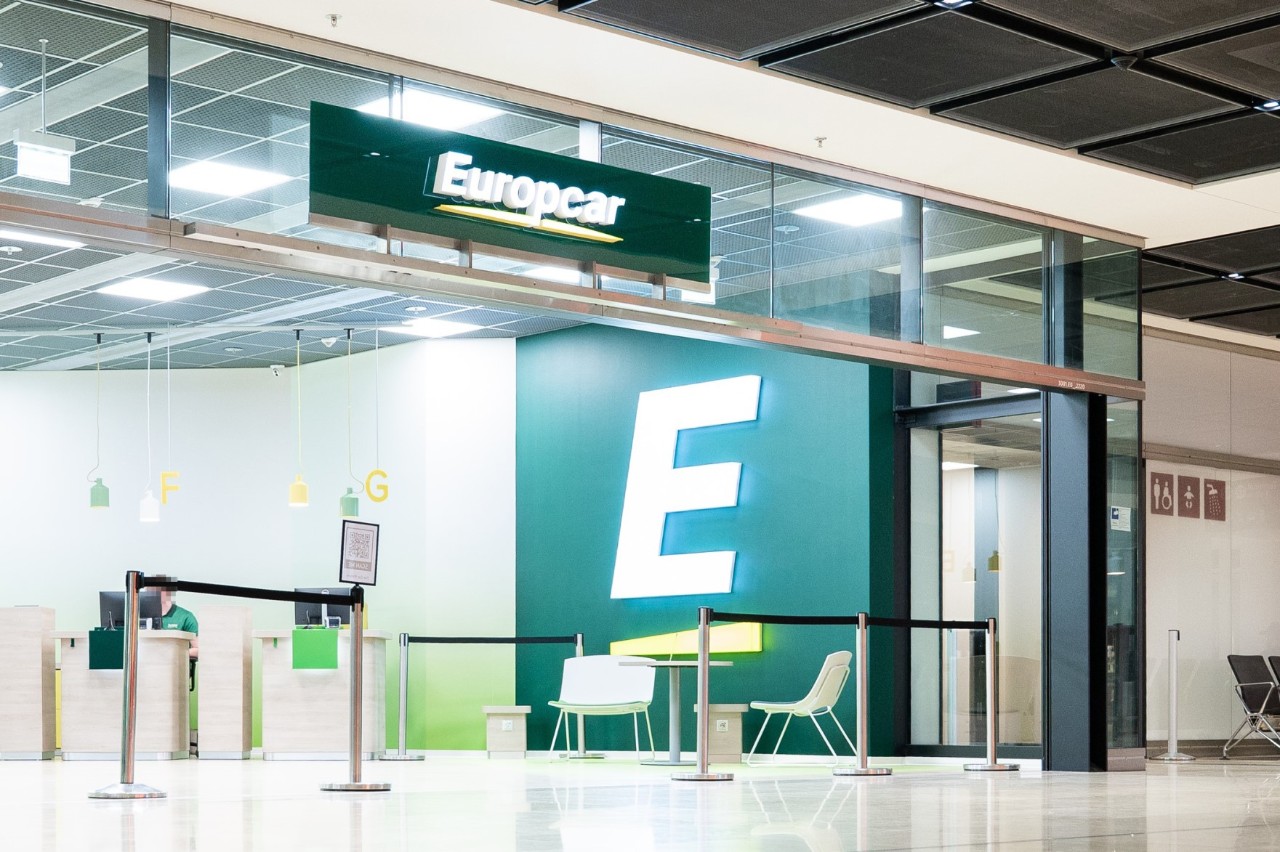 View from the outside of the green Europcar counter.