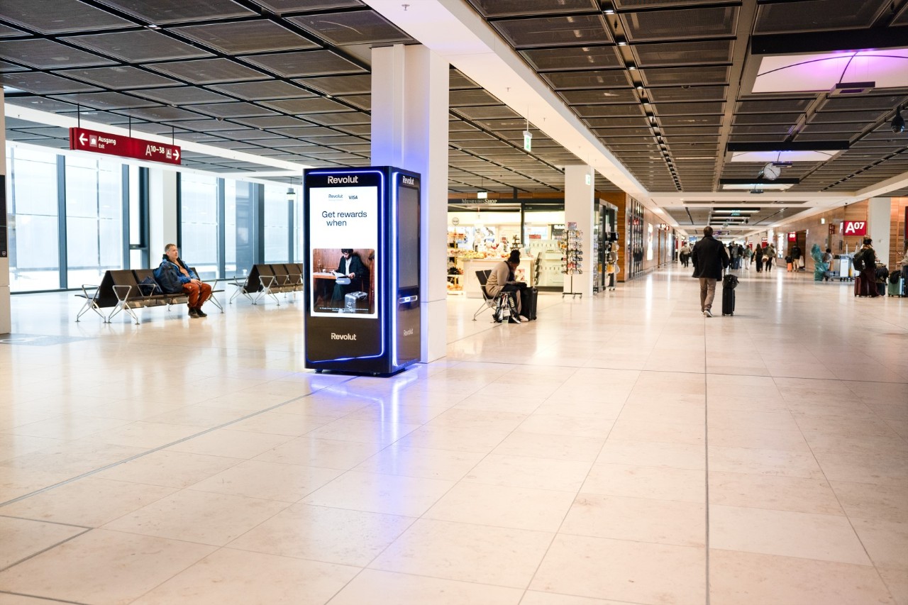 A black Revolut ATM in the terminal