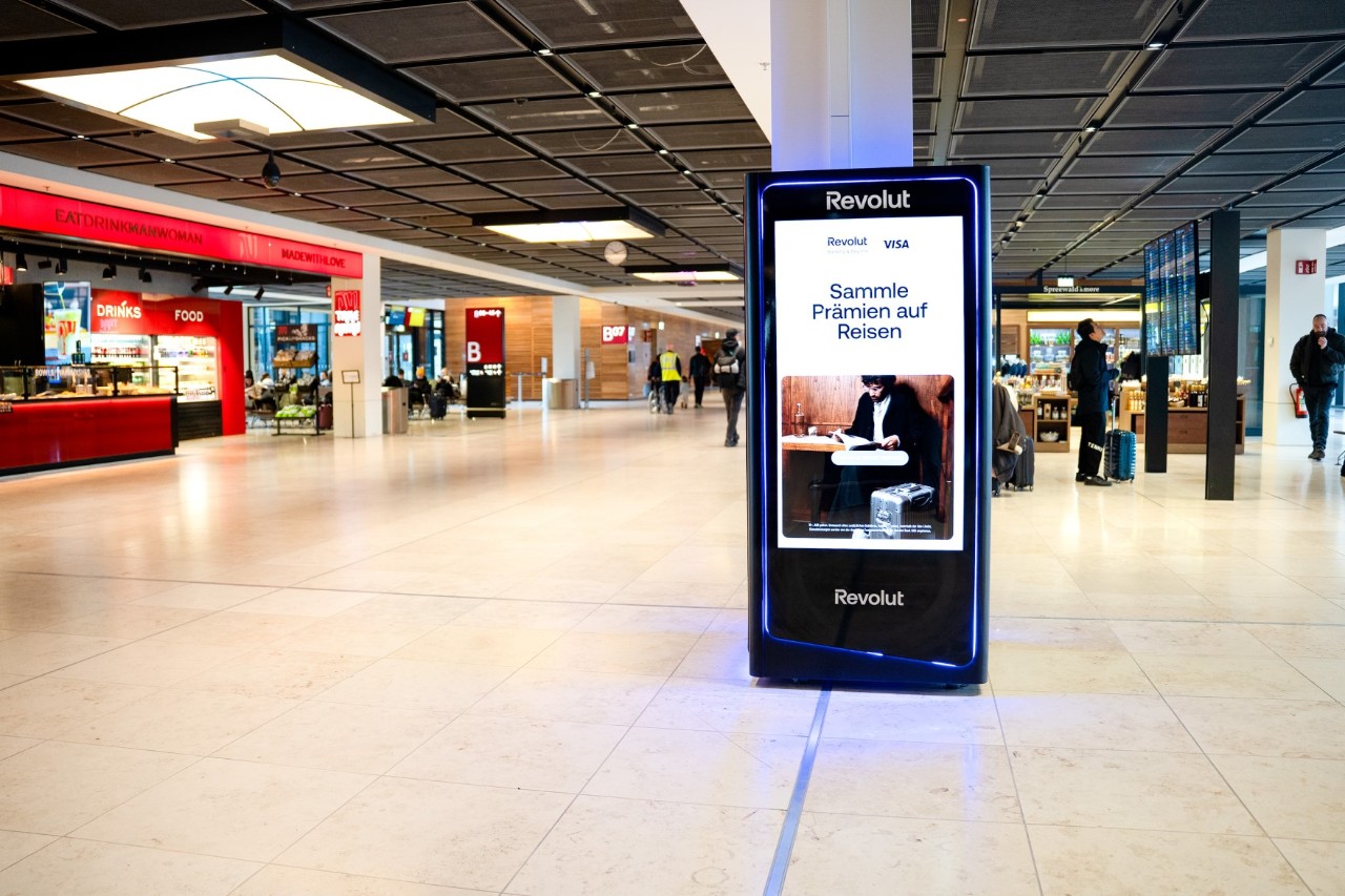 A black Revolut ATM in the terminal