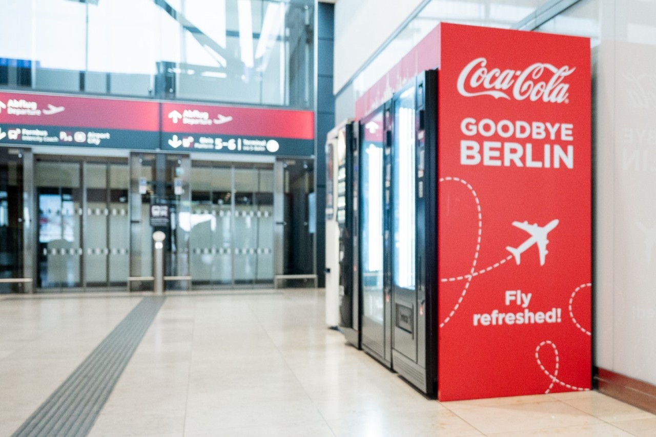 Coca-Cola vending machine in Terminal 1, with a lift in the background.