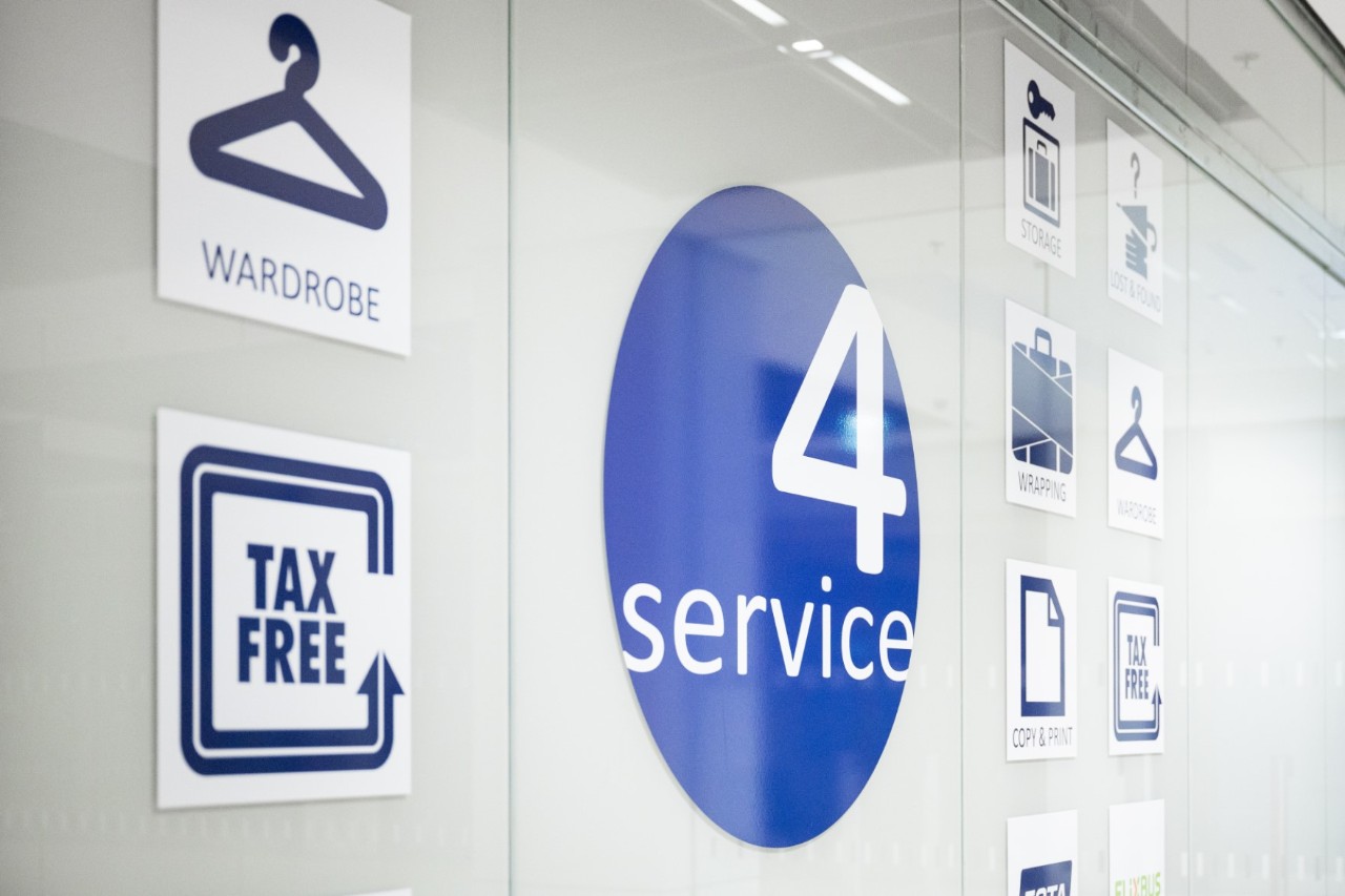 View of a 4S logo and its services through a pane of glass