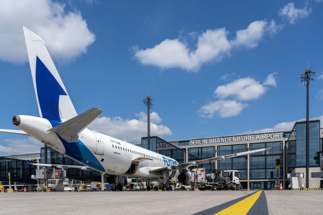 FlyOne aircraft in front of Terminal 1.