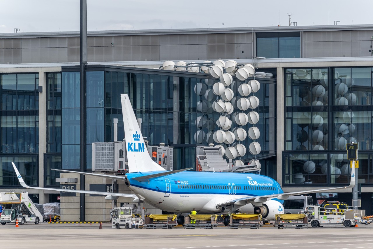 blue KLM plane in front of Terminal 1