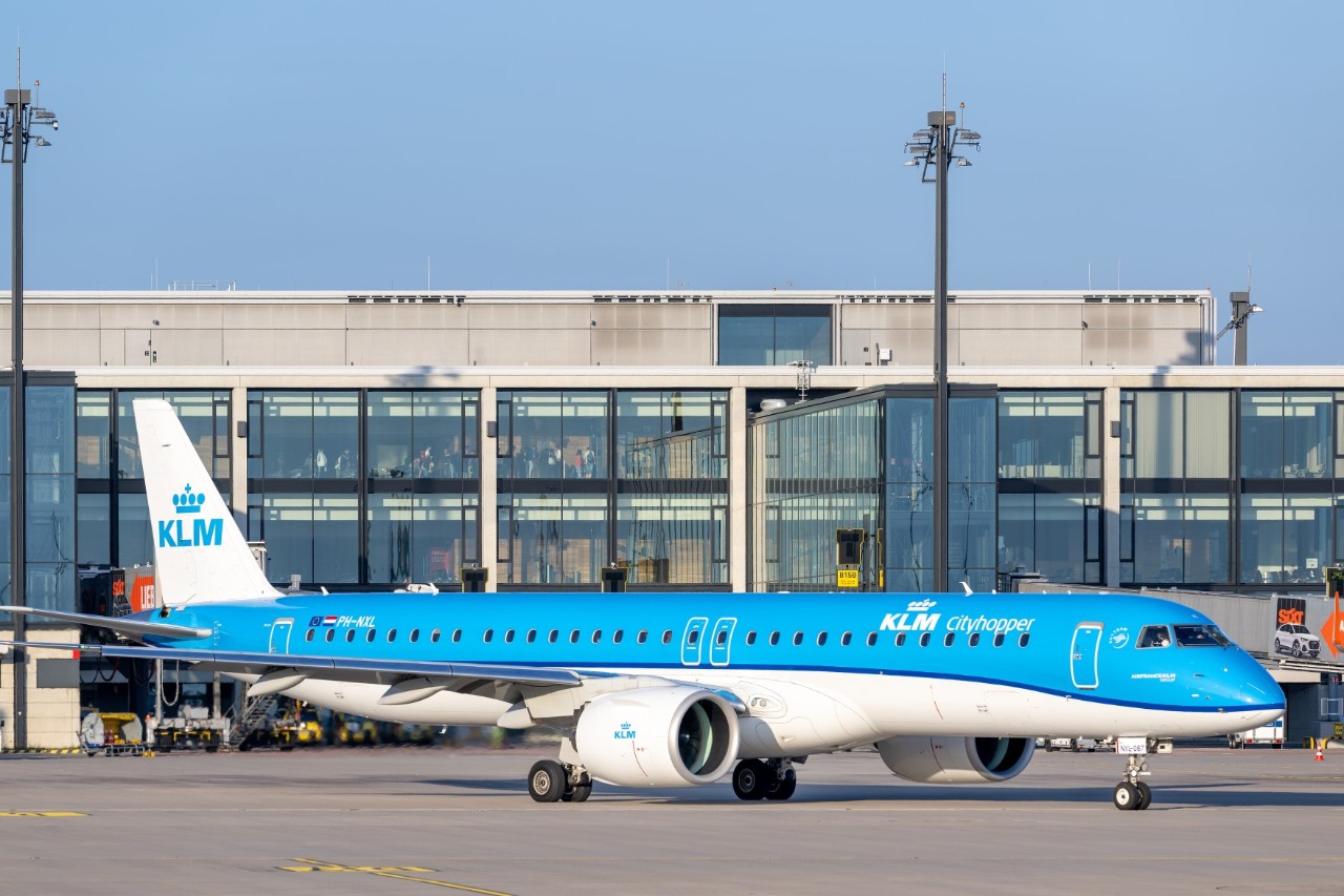 blue KLM plane in front of Terminal 1