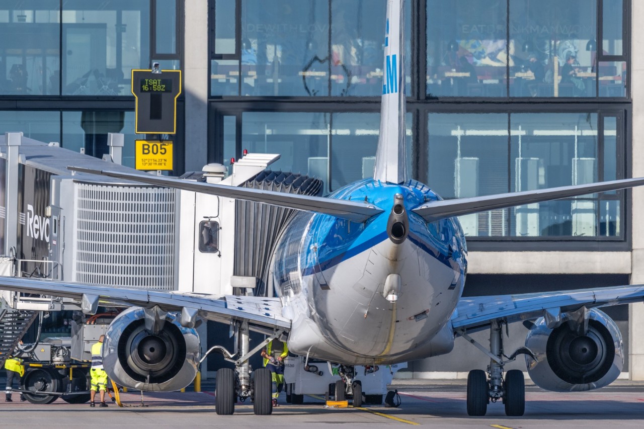 blue KLM plane in front of Terminal 1