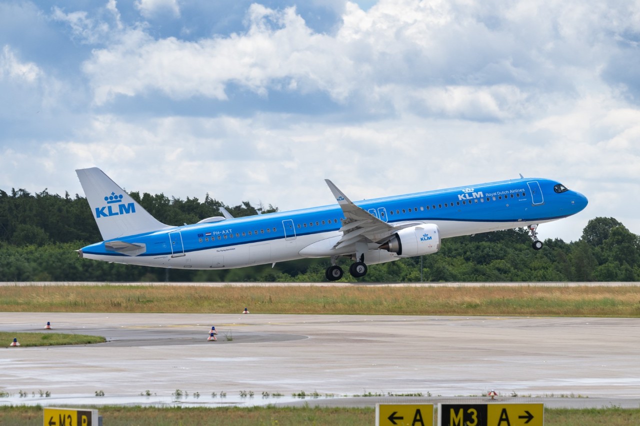 blue KLM plane in front of Terminal 1