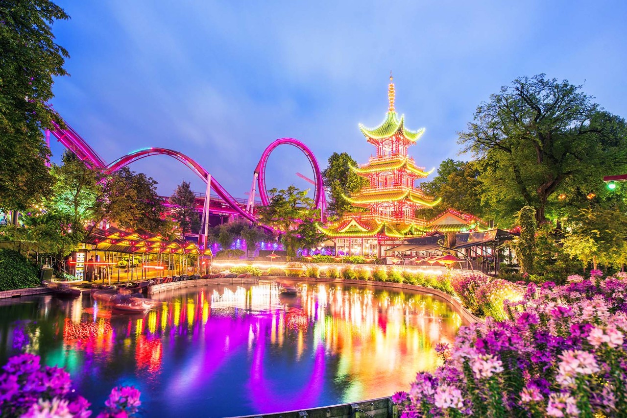 Tivoli Amusement Park in the centre of Copenhagen is one of the oldest amusement parks in the world. It offers a colourful mix of rides, restaurants and gardens. © anko_ter/AdobeStocks
