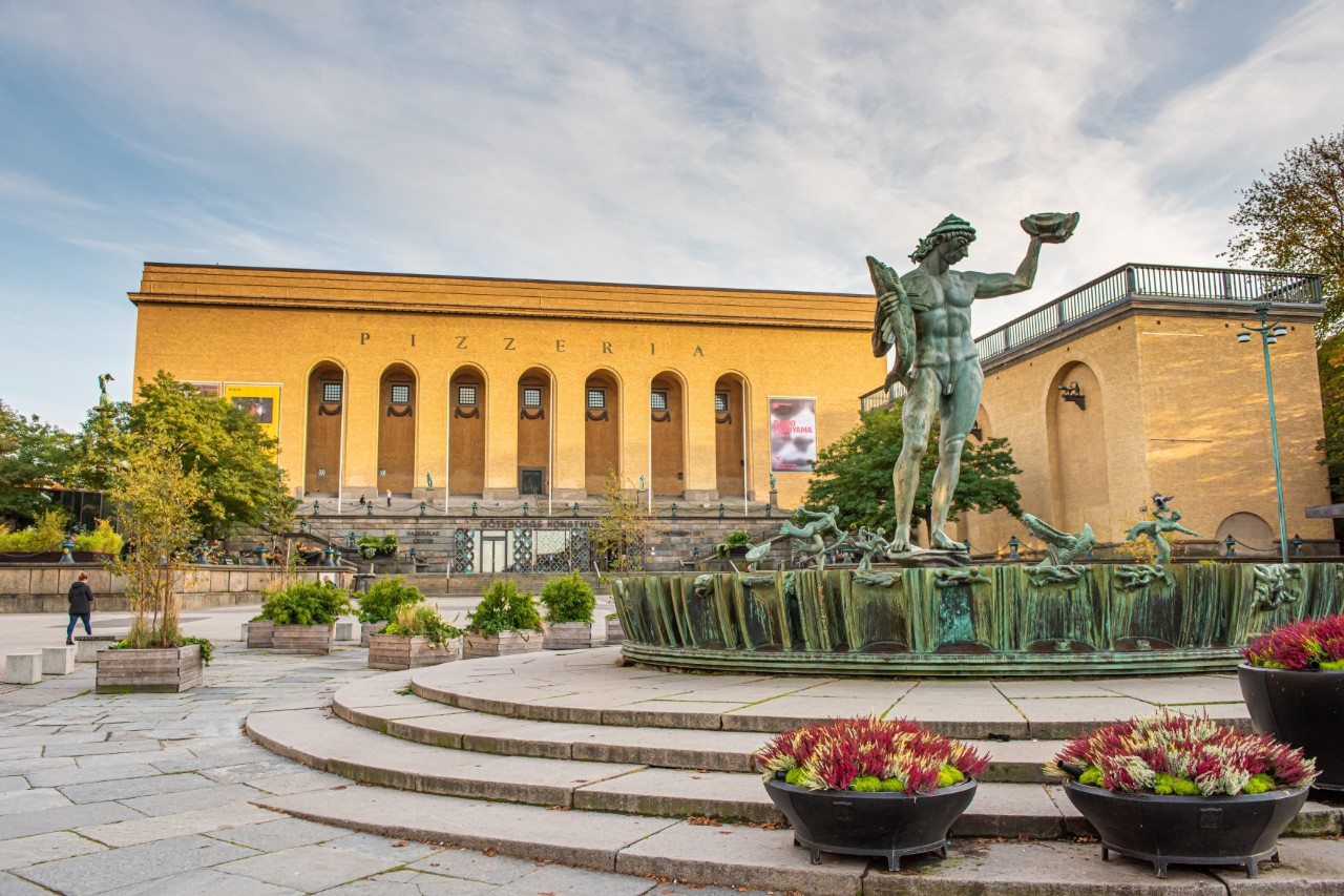Art Museum with Poseidon figure, colorful plants, stairs with statue © Trygve/stock.adobe.com