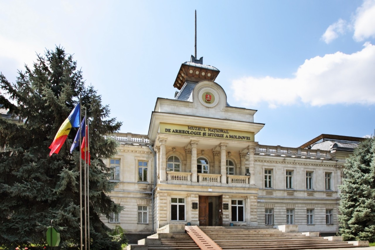 Entrance to the National Museum of History, three flags in the foreground 