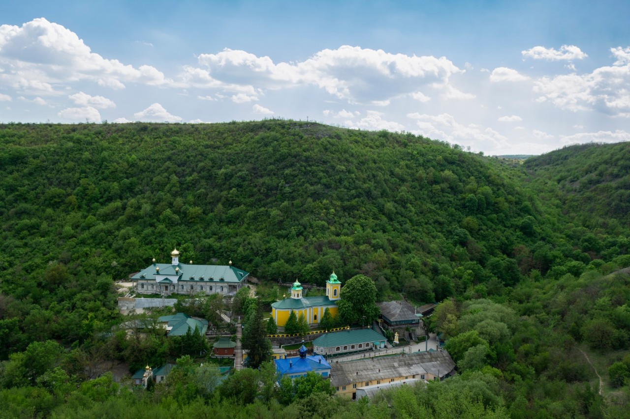 Saharna Monastery, surrounded by green forests, hilly landscape 