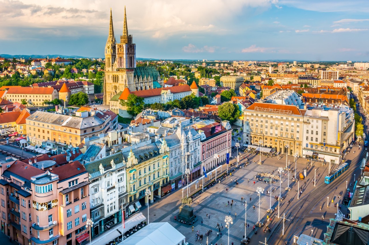 View from above of Zagreb’s city centre with elegant buildings, cathedral and a lively square  