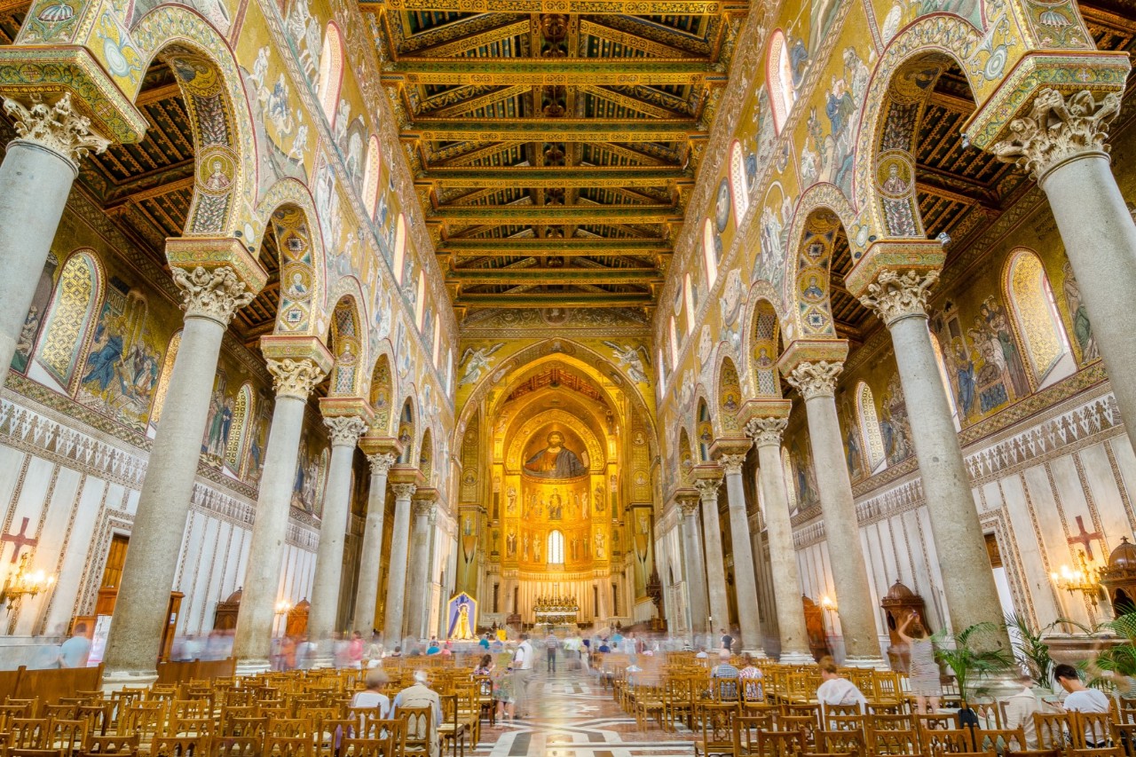 Interior of the magnificent white-gold cathedral, pillars and mosaic ceiling, seating and few visitors © dmitr86/stock.adobe.com 