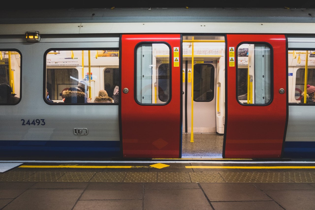 Interior view of a London Tube station with incoming train.