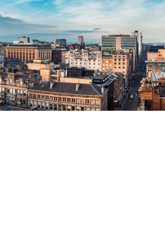 The image shows a panoramic view of the city of Glasgow.