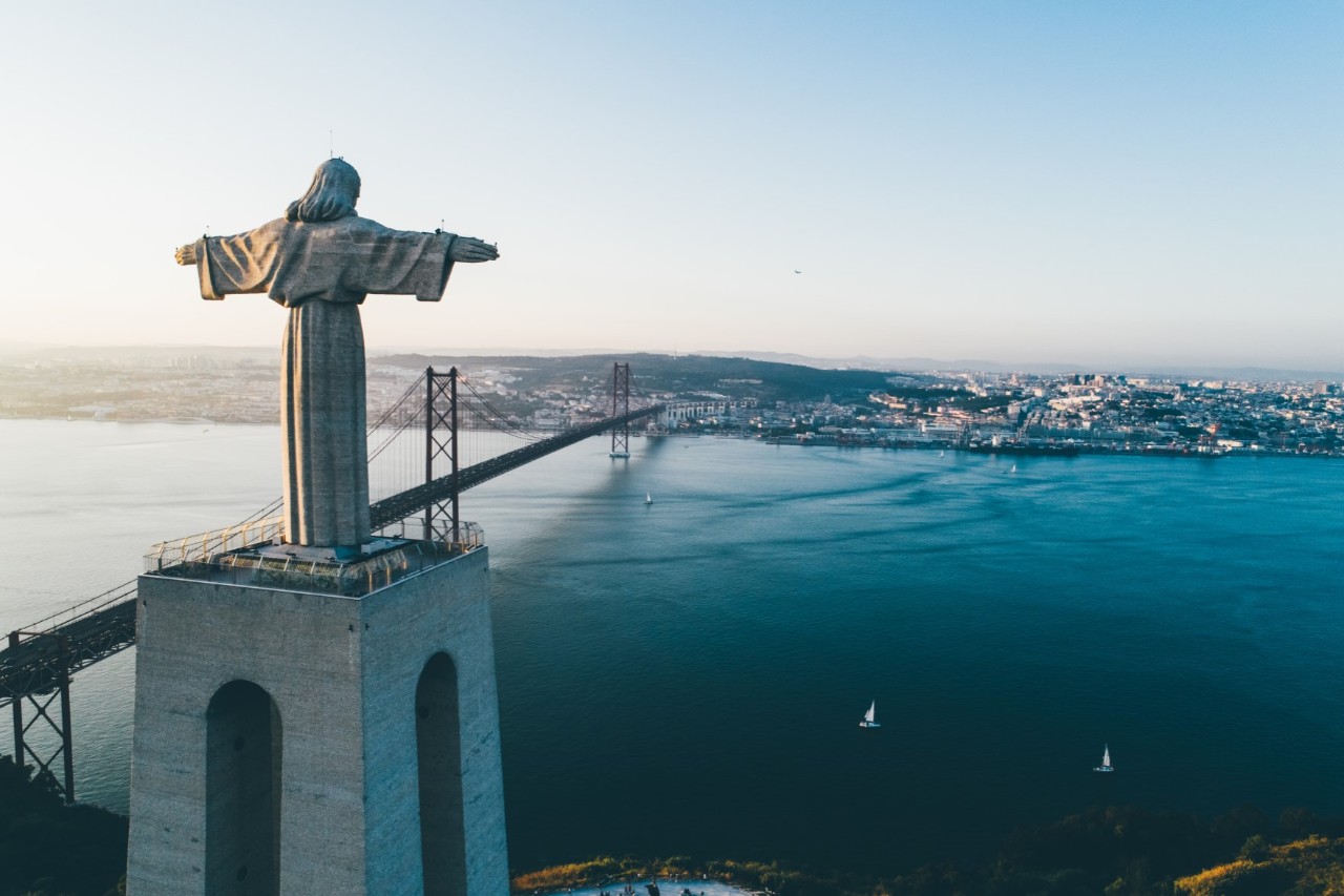 Statue of Jesus over the hills of Lisbon