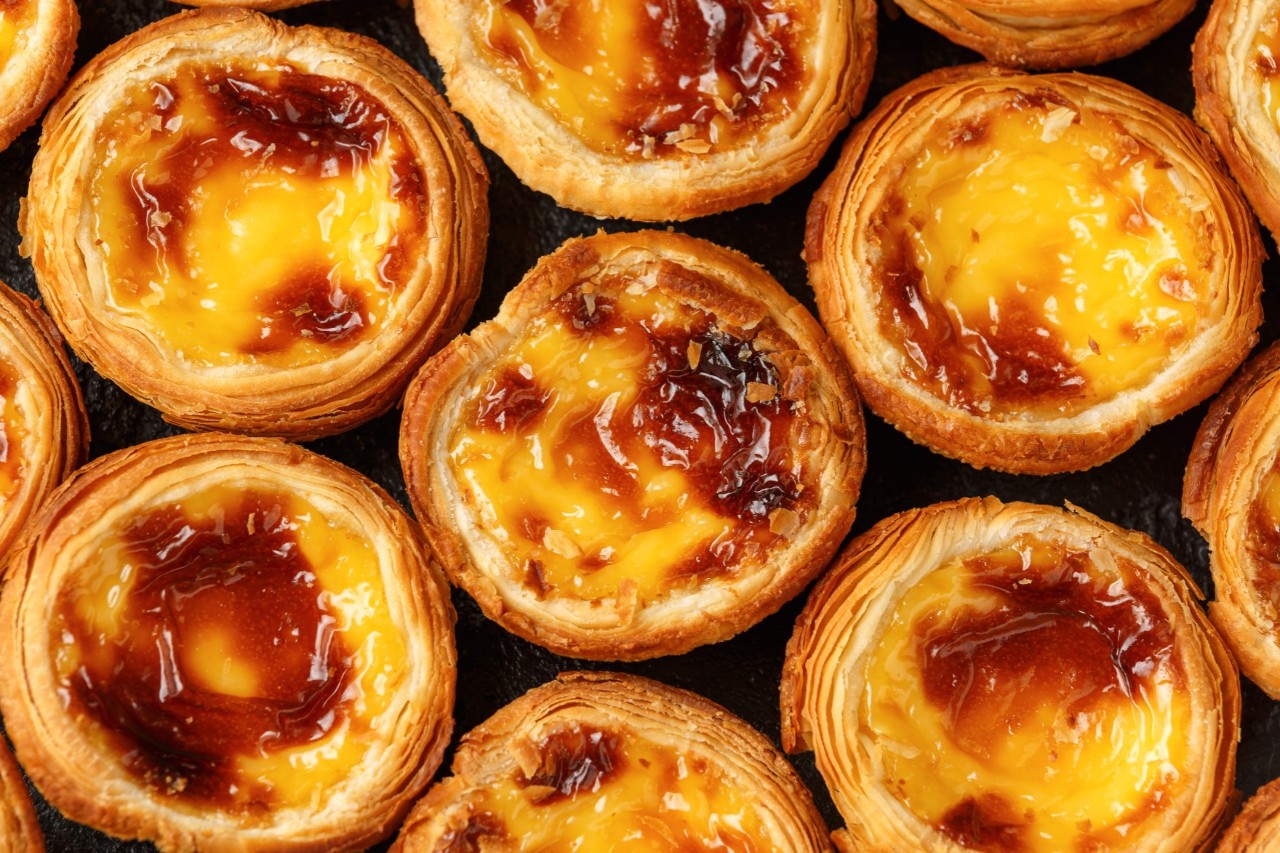 Fresh puff pastry tarts served on a plate.
