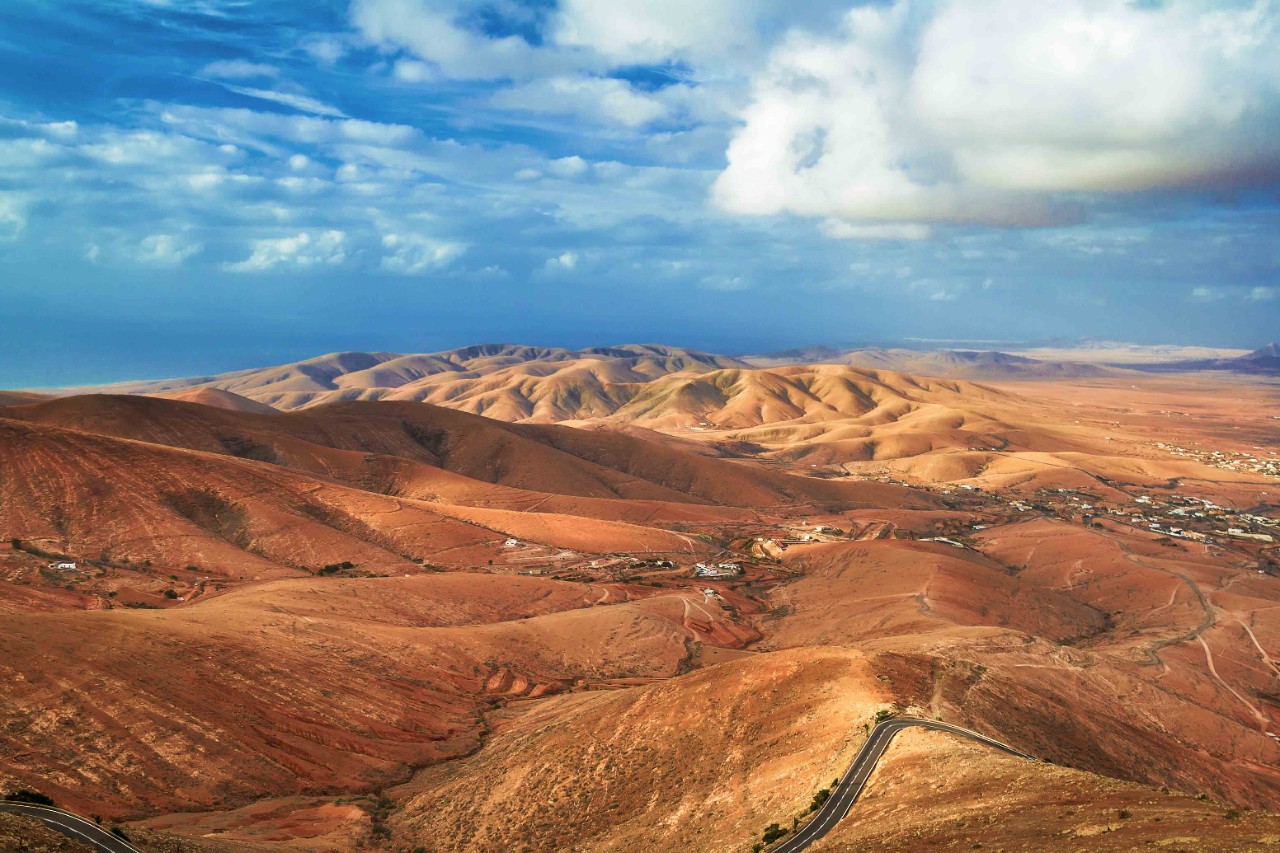Arid mountain landscape on Fuerteventura under blue sky.