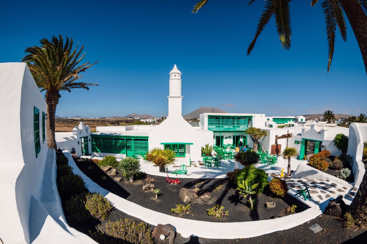 White monument with statue at Museo del Campesino in Lanzarote.