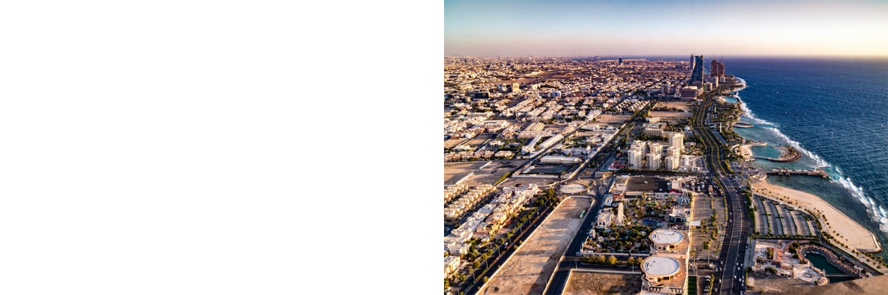 Aerial view of the city of Jeddah, situated on the coast, flat buildings with few structural high points near the water. © sainuddeen/stock.adobe.com  