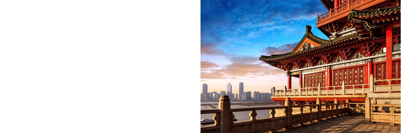 Pagoda in the foreground with modern high-rises in the background in Beijing.