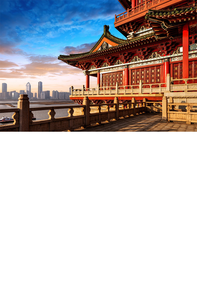 A pagoda in the foreground. Modern buildings in the background.