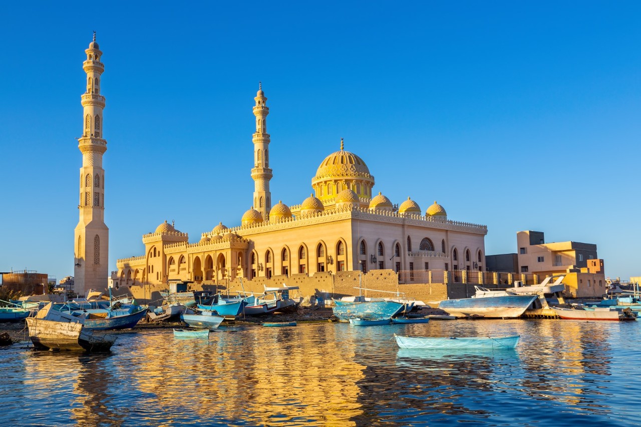 Aldahaar mosque in Hurghada, river with small boats in the foreground  