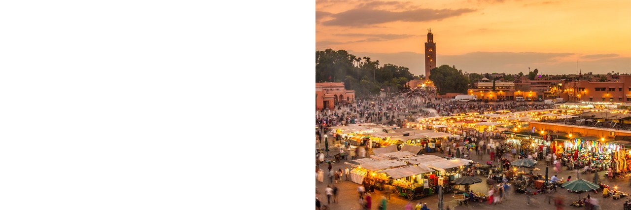 Marketplace with stalls and lots of people. Evening atmosphere.