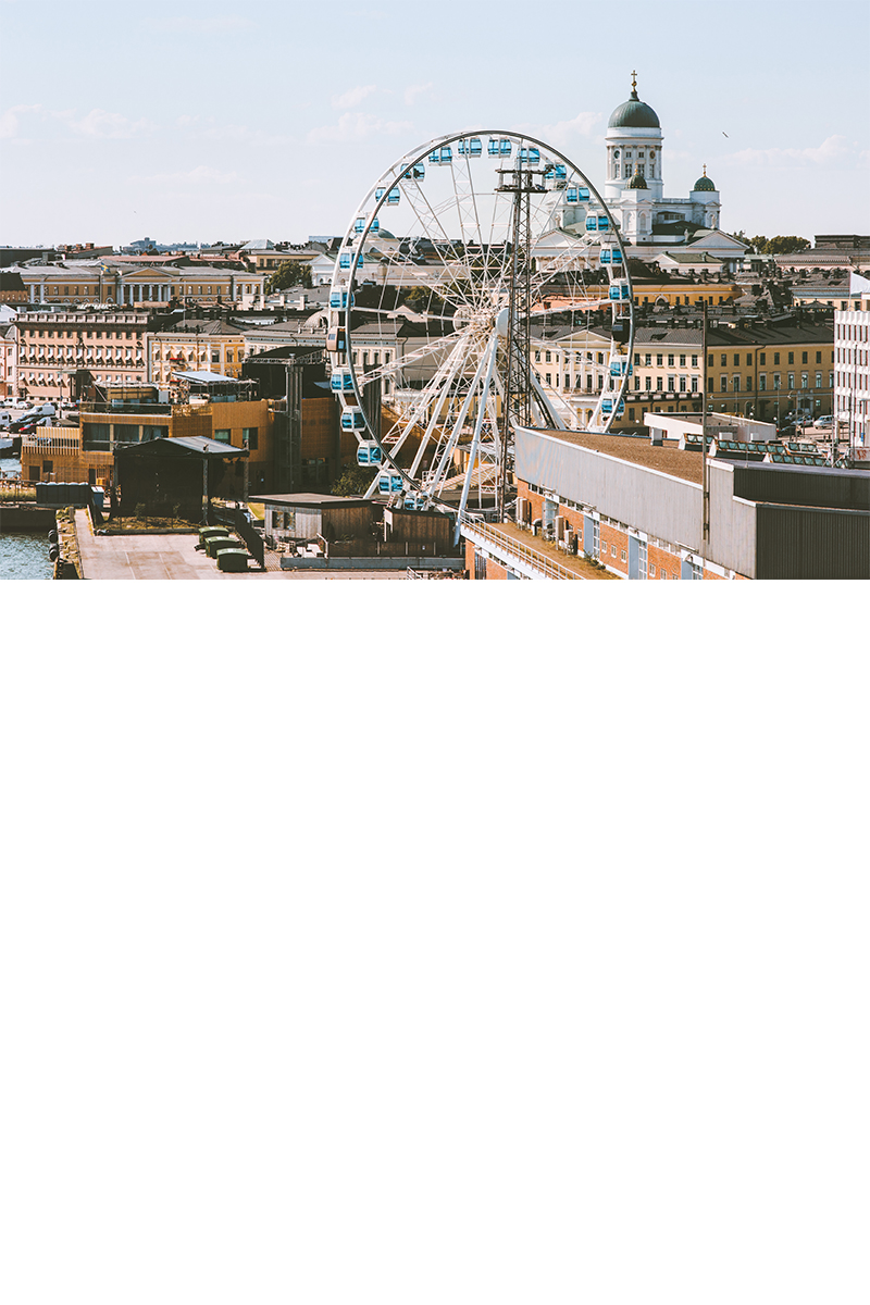Ferris wheel. Behind it, the city panorama with the cathedral.