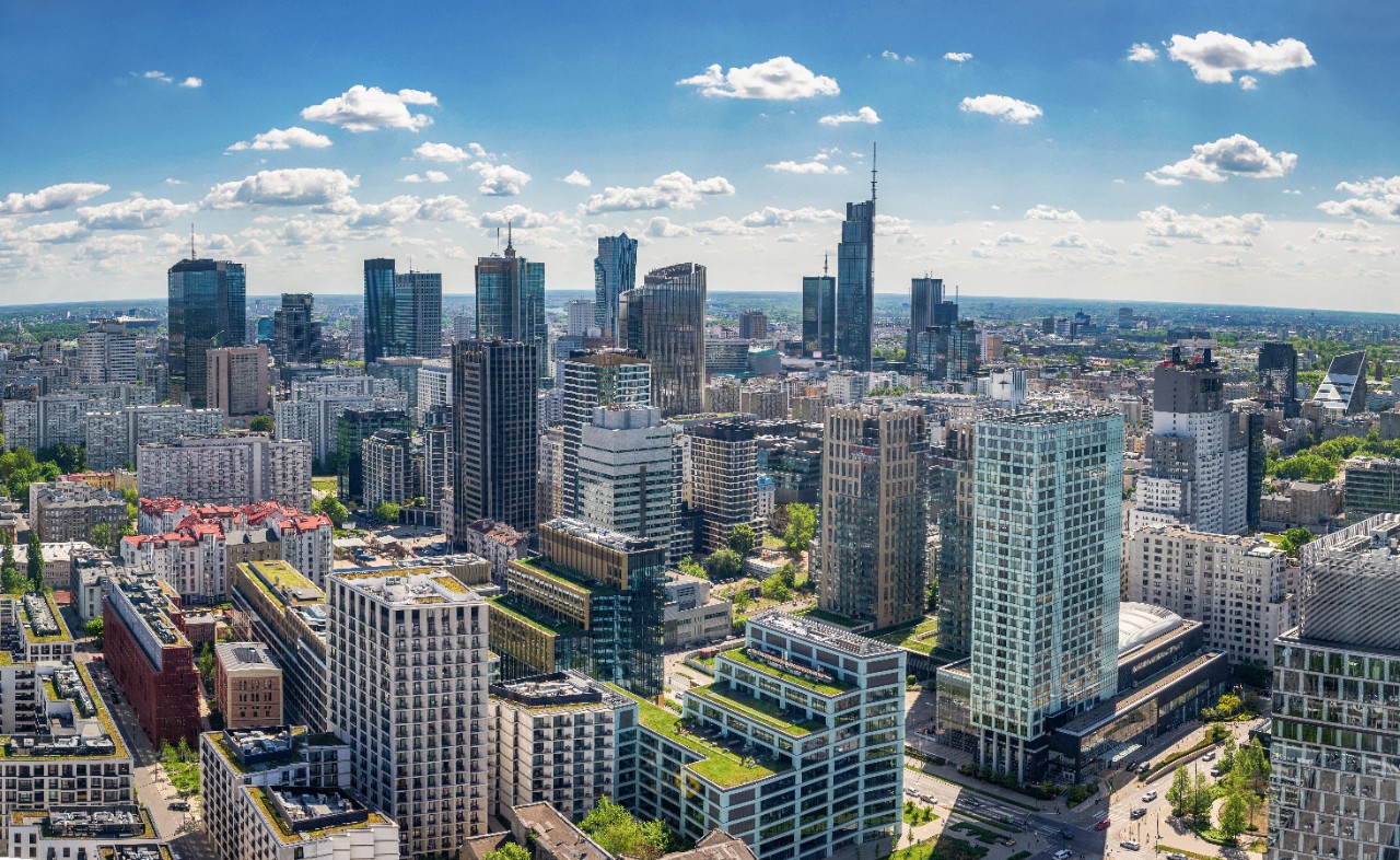 Aerial view of Warsaw's skyline with modern skyscrapers.