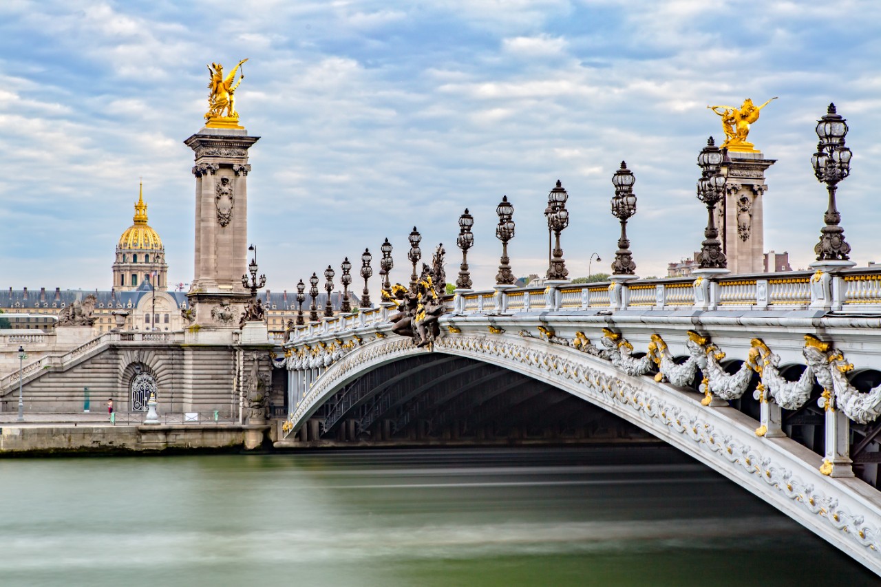 Ornate Pont Alexandre III facing Grand Palais and Hôtel des Invalides.