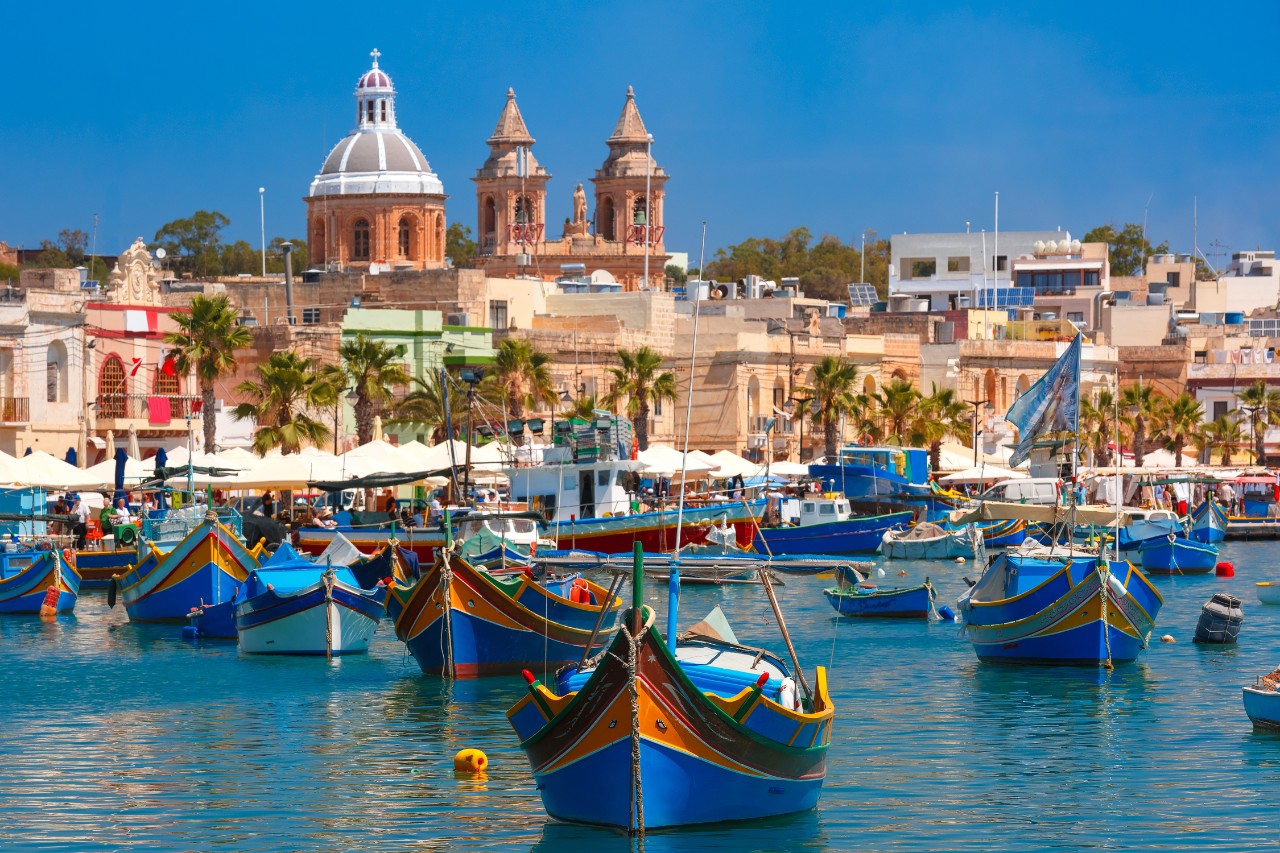 Colorful fishing boats in the harbor of Marsaxlokk in southern Malta.