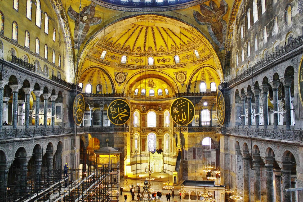 Interior of Hagia Sophia with dome and Byzantine mosaics.