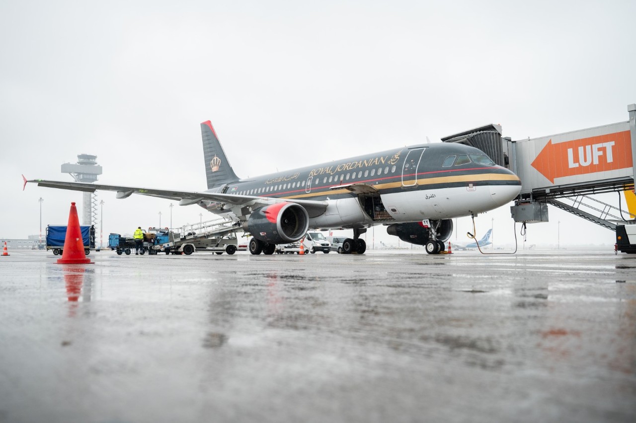 Royal Jordan Air aircraft on the apron.  Behind the tower.