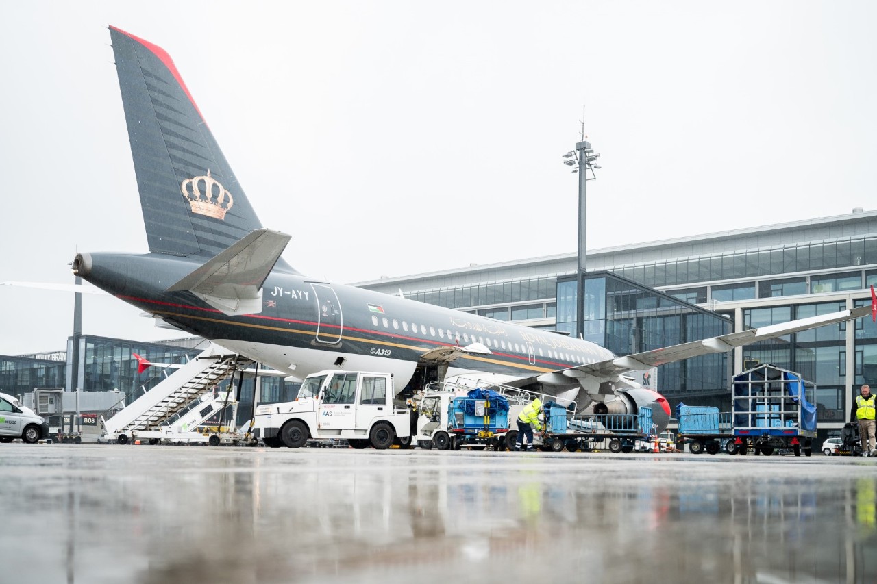Royal Jordan Air aircraft on the apron.  Behind it is Terminal 1.