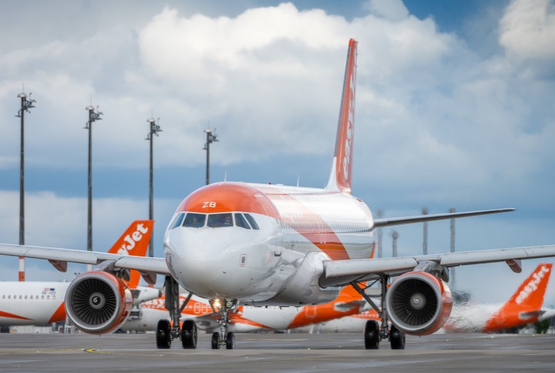 An easyJet aircraft on the apron. More easyJet aircraft can be seen in the background.