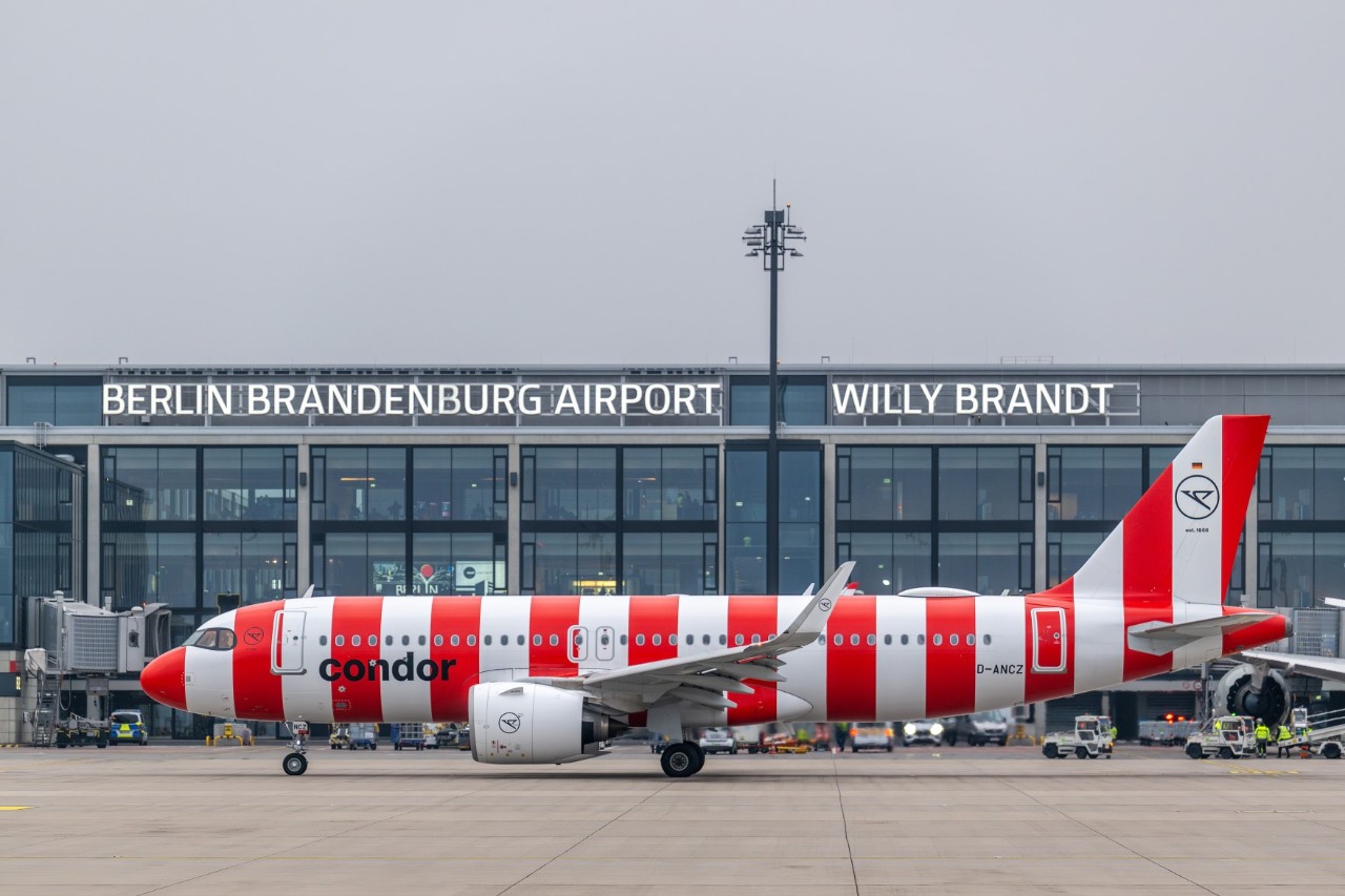Condor aircraft in front of the BER terminal building